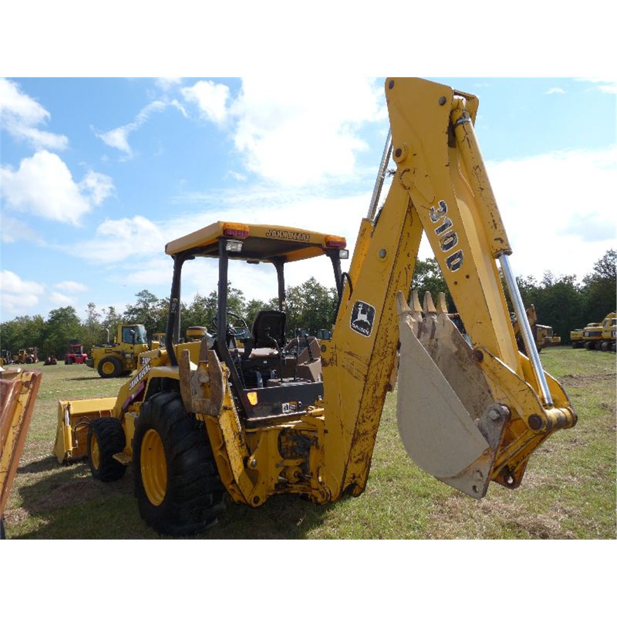 JOHN DEERE 310D 4X4 LOADER BACKHOE J.M. Wood Auction Company, Inc.