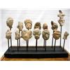 Image 1 : Collection Prehistoric Clay Heads on Display Rack