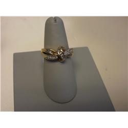 Baquette and Round 1 CT Diamond Ladies Ring with Criss-Crossed 14K gold band tied like a bow!