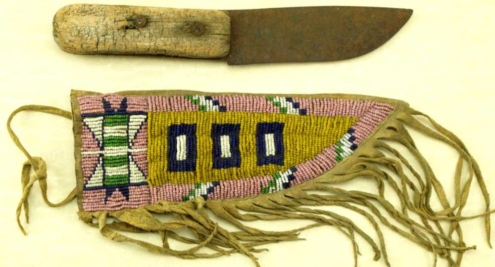 Beaded and fringed leather knife sheath