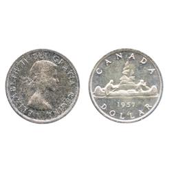 1957.  CCCS graded Mint State-65.  Medium heavy multi-hued rainbow toning.  A rare Gem.