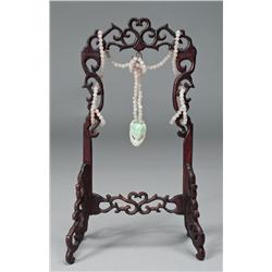 Chinese Jadeite Pendant On Carved Wood Stand
