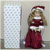 Image 1 : CHRISTMAS CAROLINE PORCELAIN DOLL - HERITAGE SIGNA