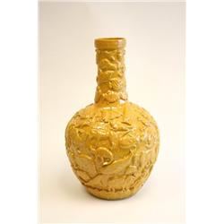 Large yellow pottery vase with animals