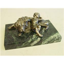 Silver sculpture "Boy Resting on Dog"