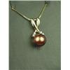 Image 1 : Charming 14K YG Ladies Pendant Set with a center black Pearl averaging 7.50mm in diameter and 4 side