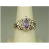 Image 1 : Dazzling 14K YG Ladies Ring Set with a center MQ cut Tanzanite weighing approx 1.00 carats and surro