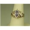 Image 2 : Dazzling 14K YG Ladies Ring Set with a center MQ cut Tanzanite weighing approx 1.00 carats and surro