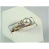 Image 1 : Elegant 10K Yellow Gold Ladies Ring Set with a center round pearl averaging 7.00mm in diameter and s