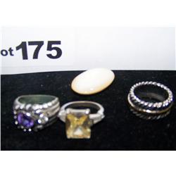 (4)Piece Lot inclu. 3 Nice Ladies Rings 1. Large stone appearing to be mother of Pearl