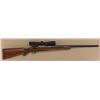 Image 1 : Ruger model 77 bolt-action rifle, .25-06  caliber, factory 25” heavy round barrel,  mounted with Red