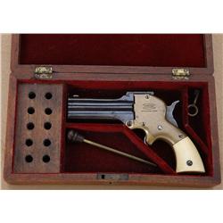 Cased Marston three barrel derringer, .32  cal., 3” barrels, blue finish, brass frame,  ivory grips,