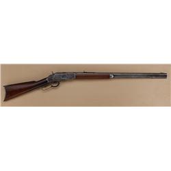 Winchester Model 1873 lever action rifle,  engraved, .44 cal., 26” octagon barrel, blue  finish, woo