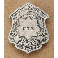 Cast metal shield badge marked “Ute Police,  Fort Duchesne, Utah, 6”; overall good  condition showin
