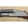 Image 1 : L. C. Smith “Monogram” grade 12ga side by  side shotgun, 3” chambers, 32” barrels,  single trigger, 