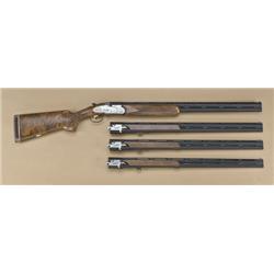 Beretta model 687 EELL 4-barrel set, finely  game scene engraved, sideplate locks, single  trigger, 