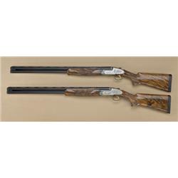 Pair of Perazzi SCO 12ga over/under shotguns,  elaborately high-art engraved in old-west  motifs ins