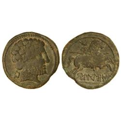 As. -  BELIGIOM. -  Anv.: Cabeza barbada a derecha, detrás letra ibérica Be. Rev.: Jinete con lanza