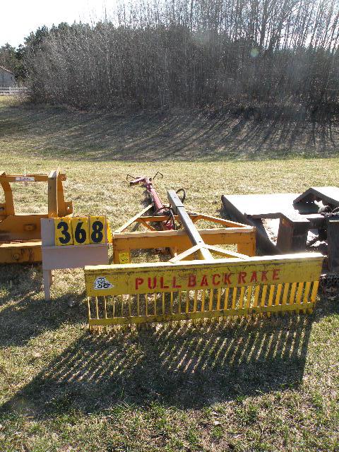 skid loader boom w/pull back rake