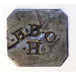 HUDSON’S BAY COMPANY. H.B.C./H. (for Hazelton). Stamped on a tin square with its corners clipped. 26