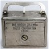 Image 1 : THE BRITISH COLUMBIA TRUST CORPORATION. A square satchel bank. Coin slot and banknote hole on right.