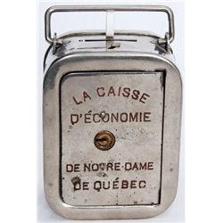 LA CAISSE D’ECONOMIE DE NOTRE-DAME DE QUEBEC. A tall steel satchel bank with rounded corners. Also k