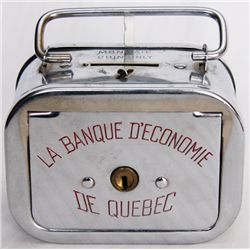 LA BANQUE D’ECONOME DE QUEBEC. A satchel bank with round corners. Coin slot on top, banknote hole at