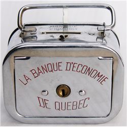 LA BANQUE D’ECONOME DE QUEBEC. A satchel bank with round corners. Coin slot on top, banknote hole at