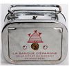 Image 1 : LA BANQUE D’ESPARGNE DE LA CITE ET DU DISTRICT DE MONTREAL. A satchel bank, with rounded corners. Co