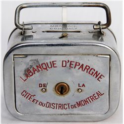 LA BANQUE D’ESPARGINE DE LA CITE ET DU DISTRICT DE MONTREAL. A rectangular satchel bank, with rounde