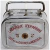 Image 1 : LA BANQUE D’ESPARGINE DE LA CITE ET DU DISTRICT DE MONTREAL. A rectangular satchel bank, with rounde