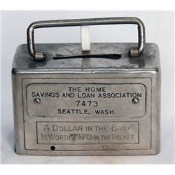 THE HOME SAVINGS AND LOAN ASSOCIATION, SEATTLE, WASH. A rectangular satchel bank. Name plate on fron