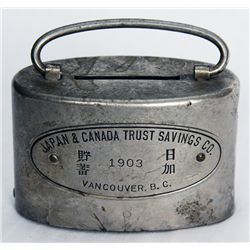 JAPAN & CANADA TRUST SAVINGS CO., VANCOUVER, B.C. Oval satchel bank. Coin slot at top. Banknote hole