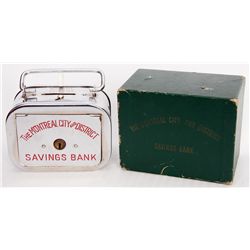 THE MONTREAL CITY AND DISTRICT SAVINGS BANK. A rectangular satchel bank, with rounded corners. Coin 