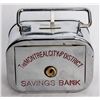 Image 1 : THE MONTREAL CITY AND DISTRICT SAVINGS BANK. A rectangular satchel bank, with rounded corners. Coin 