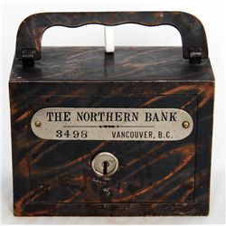 THE NORTHERN BANK, VANCOUVER, B.C. A steel satchel bank, with square corners. Coin slot at right, wi