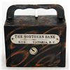 Image 1 : THE NORTHERN BANK, VANCOUVER, B.C. A steel satchel bank, with square corners. Coin slot at right, wi