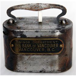 SAVINGS DEPARTMENT THE BANK OF VANCOUVER, VANCOUVER, B.C. An oval steel satchel bank. Coin slot on l