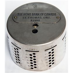 THE HOME BANK OF CANADA/ST. THOMAS, ONT. An cylindrical bank. Slots arranged horizontally along top 