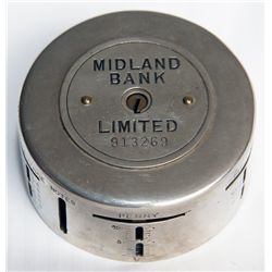 MIDLAND BANK LIMITED (UK). A cylindrical steel ‘Day and Night’ bank. Slots arranged horizontally alo