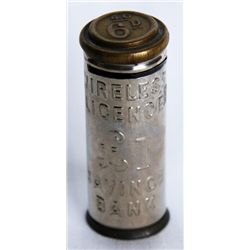 COIN TUBE. ‘WIRELESS LICENSE & SAVINGS BANK’ on side. 6d. (six pence). 2cm x 5cm. Nickel plated fini