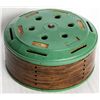 Image 1 : HOME BUDGET BANK. Cylindrical shape. 15cm in diameter, 7cm in height. Green metal, with wood grain a