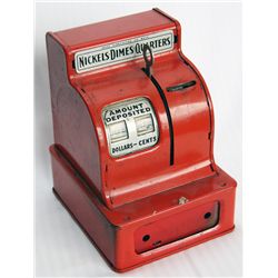 A TOY CASH REGISTER BANK. Coin slot at top, right. 11cm x 11cm x 15cm in height. Red metal. Fine.