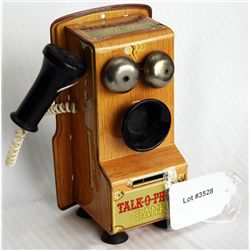 TALK-O-PHONE BANK. Shaped like an Antique Wall Phone. Coin slot at lower front. 8cm x 10cm x 18cm. T