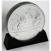 Image 1 : CANADA DOLLAR/VOYAGEUR SILVER DOLLAR. Coin shape/on base. Coin slot on top. 15cm. In height. Silver 