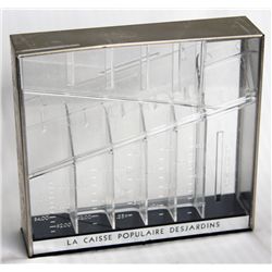 LA CAISSE POPULAIRE DESJARDINS. A rectangular clear plastic bank, with the coin slot on top. 17cm x 