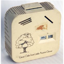 GREAT OAKS FROM LITTLE ACORNS GROW’. A rectangular Coin Calendar bank. Four coin slots on front, one