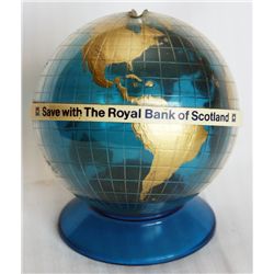 SAVE WITH THE ROYAL BANK OF SCOTLAND. A blue, gold and white plastic globe shaped bank. Coin slot on