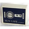 Image 1 : SUN LIFE OF CANADA. A rectangular Coin Calendar bank. Two coin slots on front. Currency slot on back