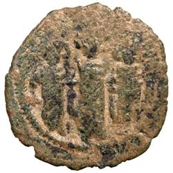 ARAB-BYZANTINE: Three Standing Figures, ca. 685-700, AE fals (2.35g), Baysan